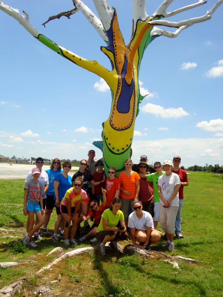 Youth mission trip group at the healing tree